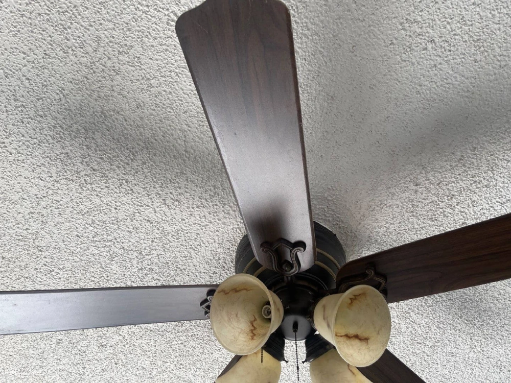 Ceiling fan blades cleaned by Fairfield House Cleaning during residential deep cleaning.